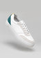 A single V8 White & Emerald Green low top sneaker with a mustard color accent on a light grey background.