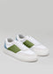 A pair of V13 White & Pine low top sneakers with green panels, laced up and placed on a light gray background.