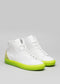 A pair of high-top MH0007 My Nuclear Soul shoes with a white leather upper and striking neon green soles, displayed against a grey background.