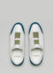 A pair of V11 White Leather w/Petrol slip-on sneakers with a green stripe, displayed on a grey background.