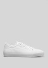 Vue latérale d'une chaussure de sport pour homme Start With a White Canvas avec lacets, présentée sur un fond gris uni.