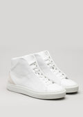 Un paio di scarpe Start with a White Canvas Vegan high-top sneakers su uno sfondo grigio chiaro.