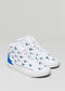 A pair of white high-top leather sneakers with blue illustrative designs and text accents on a gray background by "I Just Like Birds".