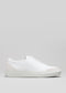 Slip On White Canvas low-top sneaker with a smooth leather upper and a white rubber outsole, displayed against a neutral gray background.