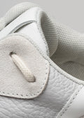 white premium leather sneakers landscape with sophisticated silhouette close-up materials