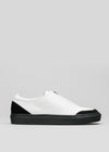 white with black premium leather slip-on sneakers with straps in clean design sideview