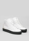 Une paire de V1 White Leather w/Bone high-top sneakers avec des semelles noires, présentée sur un fond gris clair.