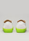 Rear view of a pair of SO0001 JL Fluo-Corra with neon green soles and detailing on a light gray background.