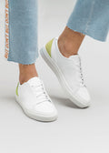 girl wearing the minimal low in white and limegirl wearing the minimal low in white and lime