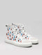A pair of Dead or Alive 3/5 white canvas high-top sneakers with a colorful pattern of small human figures printed over a gray background.