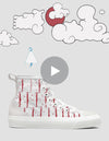 A digital image featuring a white high-top canvas sneaker with red shoelaces and anchor patterns, set against a playful background with doodle-style clouds and a bird. A play button icon is in A Blissful Death 3/5.
