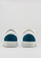 blanc et bleu pétrole cuir premium paire de sneakers en design propre vue arrièreblanc et bleu pétrole cuir premium paire de sneakers en design propre vue arrière