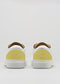 giallo e bianco in pelle premium basso paio di sneakers con suola bianca in design pulito vista posteriore